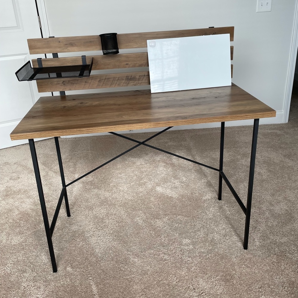 Wood desk with removable metal shelf, cup holder, and white dry erase board.